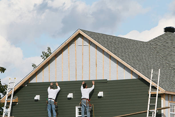 Professional Storm Damage Siding Repair technician working in Staley, NC